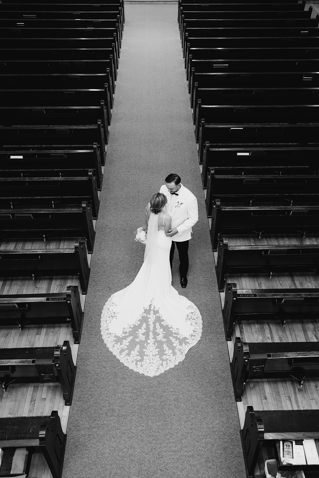 bride and groom in the isle of the church from above