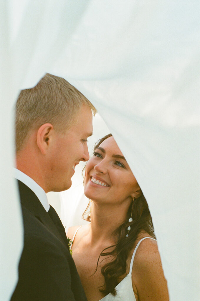 bride and groom veil portrait taken on film 